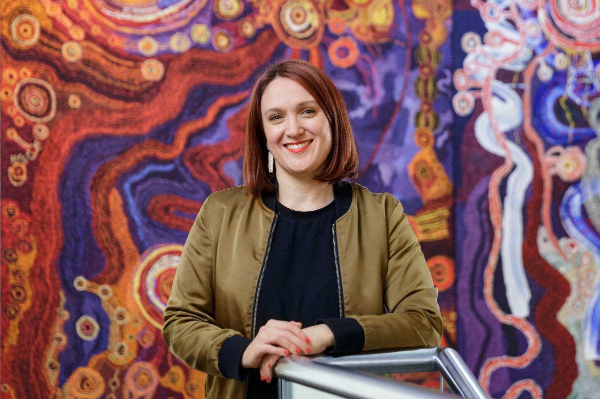 Incoming Ngununggula CEO & Director Leigh Robb with Kangkura-KangkuraKu Tjukurpa - A Sister's Story by the Ken Family Collaborative, Art Gallery of South Australia, Adelaide. Photo: Saul Steed. Courtesy: Ken Family Collaborative / Copyright Agency.